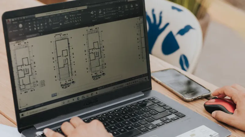 Plattegronden in CAD-software op laptop, NEN 2580 oppervlaktemeting